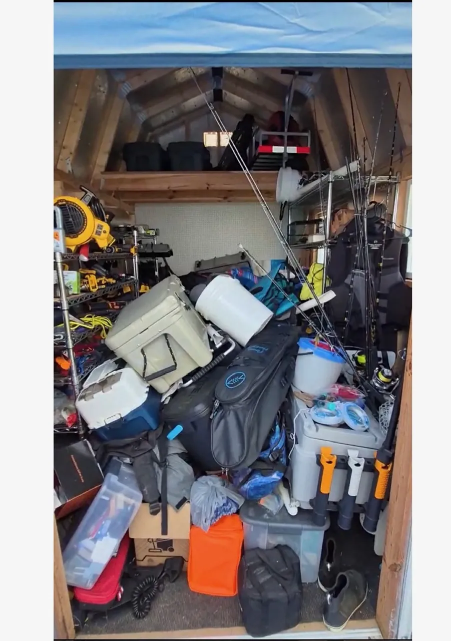 Shed cleanout before in Clearwater, FL — inaccessible, overloaded shelving