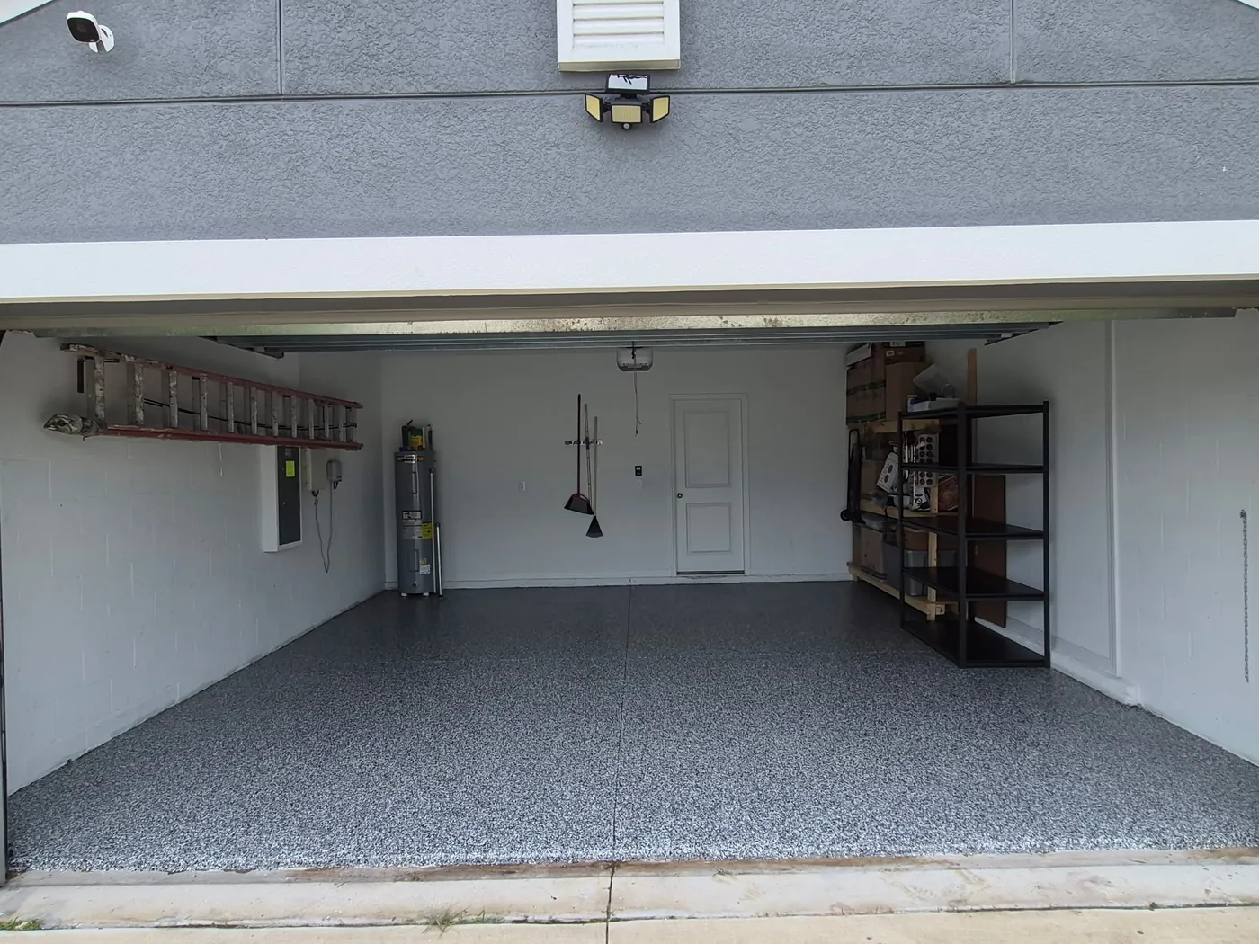 Garage floor coating after in Ruskin, FL — cleared space with gray flake floor